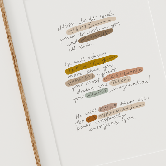 Hand-lettered Bible verse print of Ephesians 3:20 with multicolor highlights, framed in wood on white background.