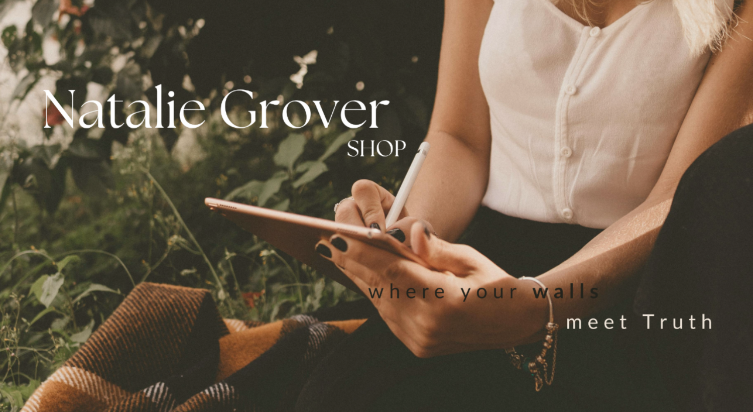 Person holding a tablet with 'Natalie Grover Shop' text overlay, "where your walls meet truth"