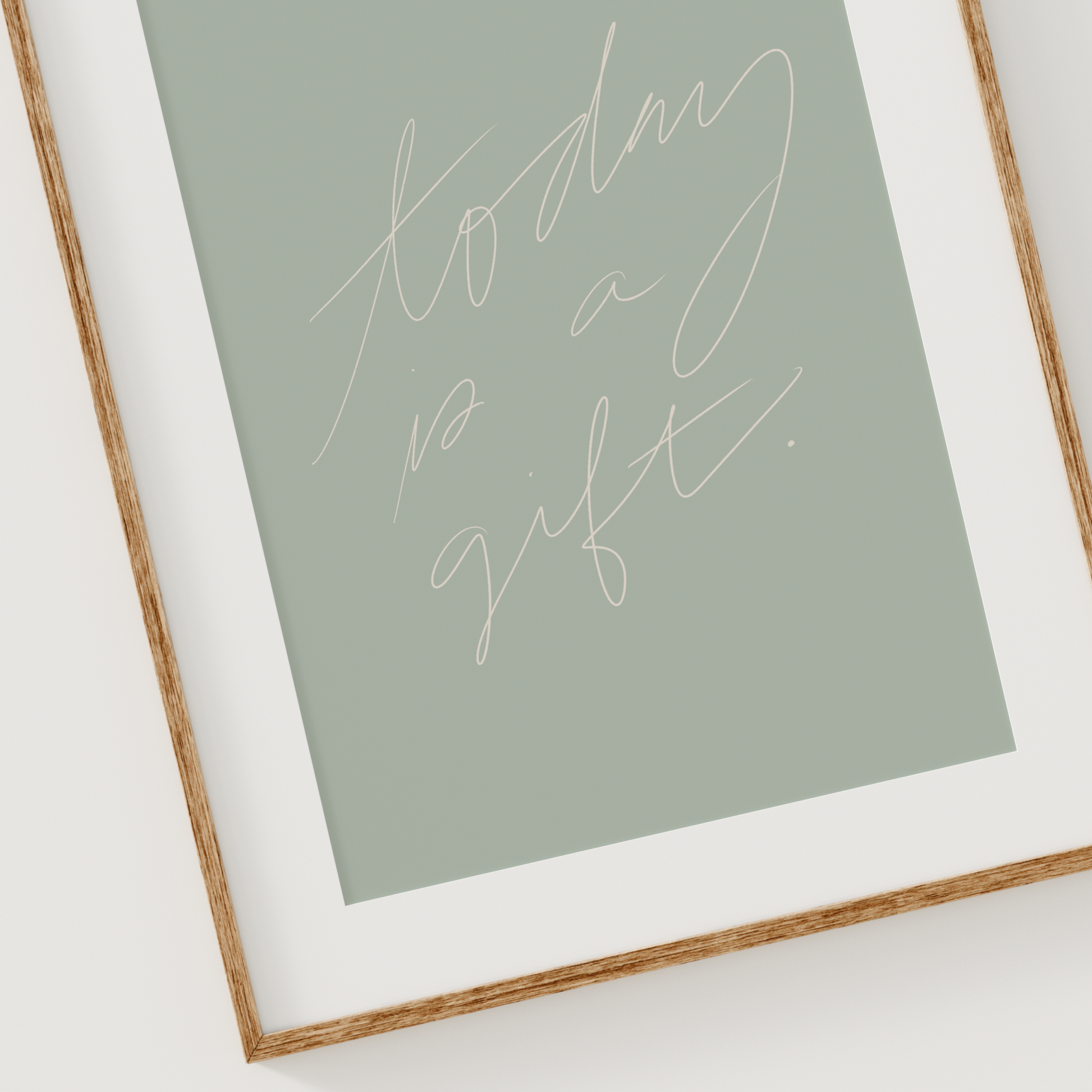 Printable christian wall art in sage green, that says, "Today is a gift" written in ivory hand lettering