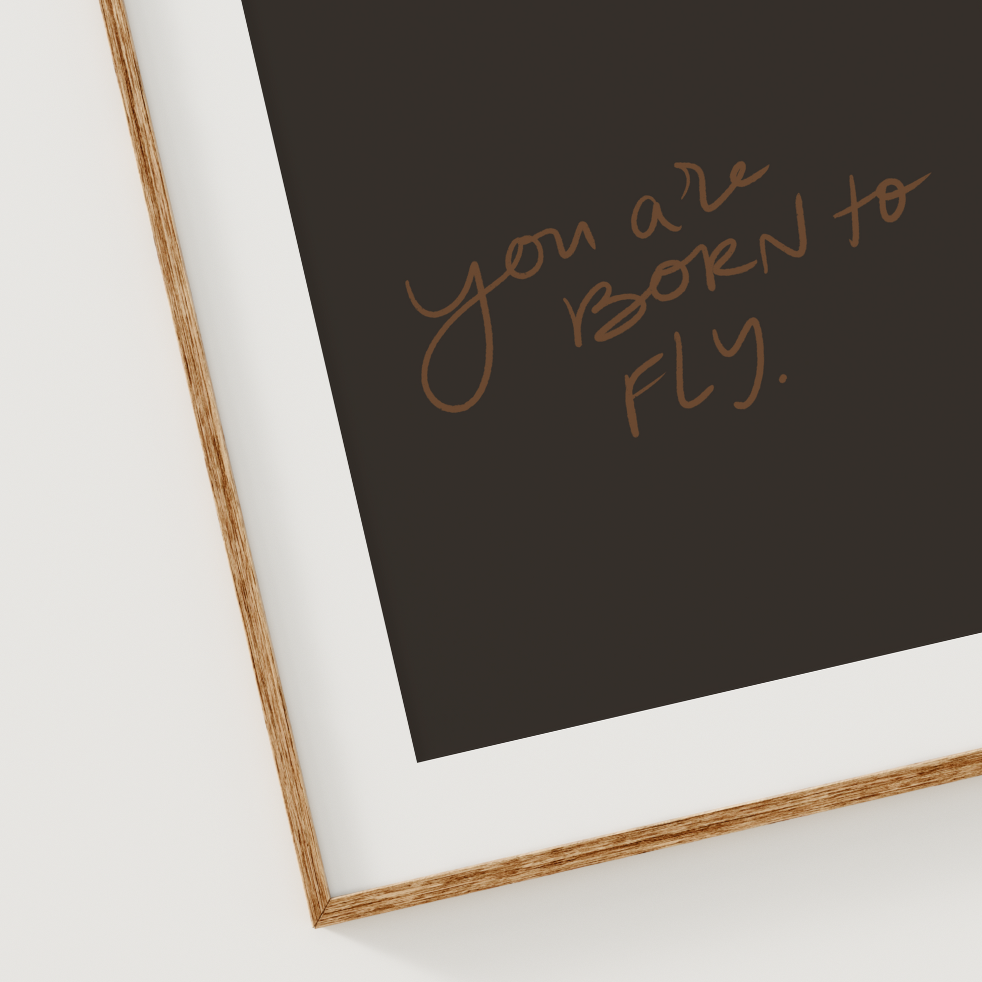 Christian printable wall art with hand lettered quote "You Are Born to Fly" in brown script on a black background for daily affirmations and encouragement.