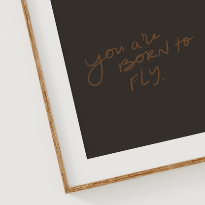 Christian printable wall art with hand lettered quote "You Are Born to Fly" in brown script on a black background for daily affirmations and encouragement.