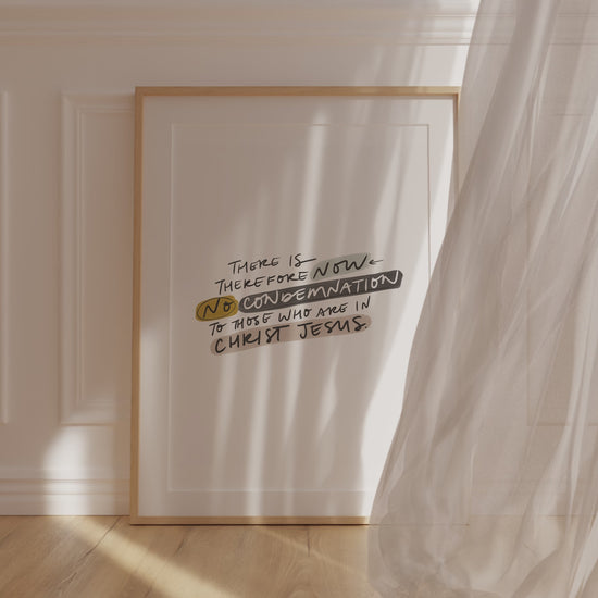 Christian art that declares scriptural truth with the bible verse, "There is therefore now no condemnation to those who are in Christ Jesus" in neutral tones, with a curtain flowing in front of it - adding peace, comfort, and tranquility